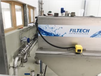 Measurement of flow and total solid content for a flocculant station