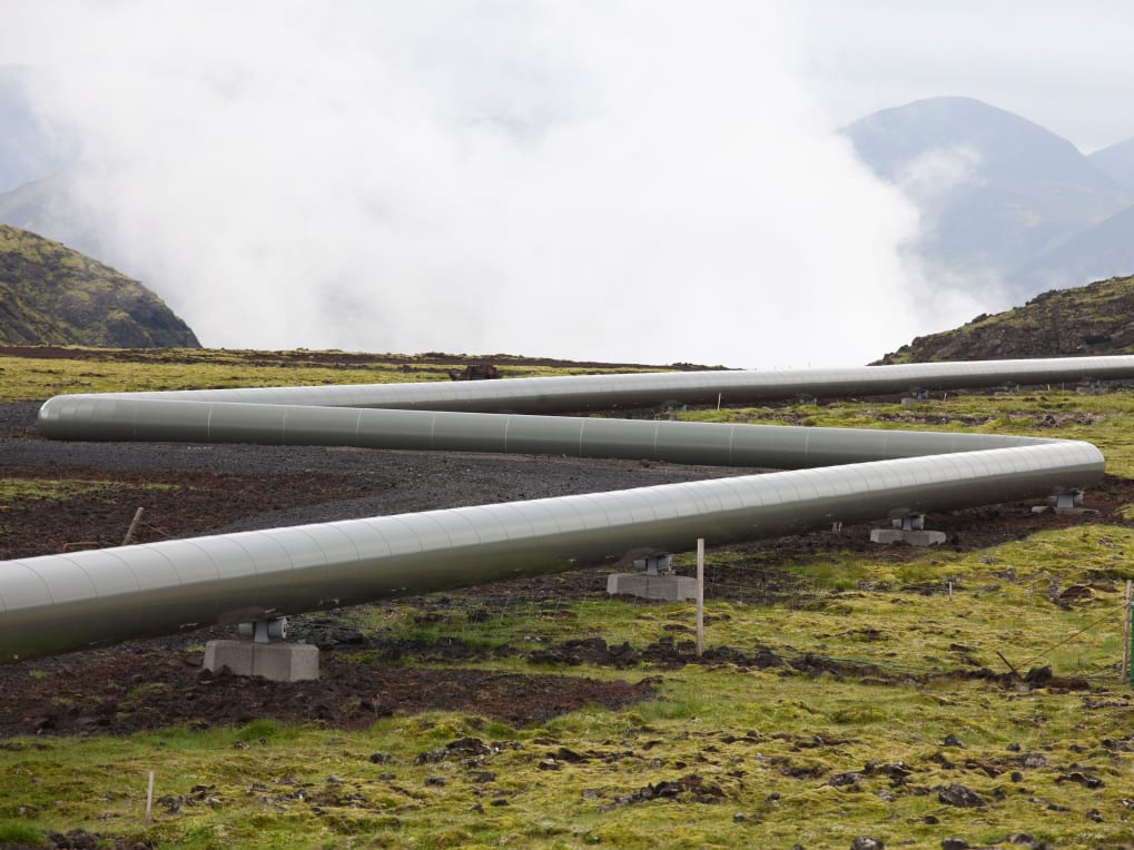 Steel pipeline on a foggy mountain