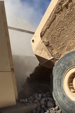 A lorry unloading stone