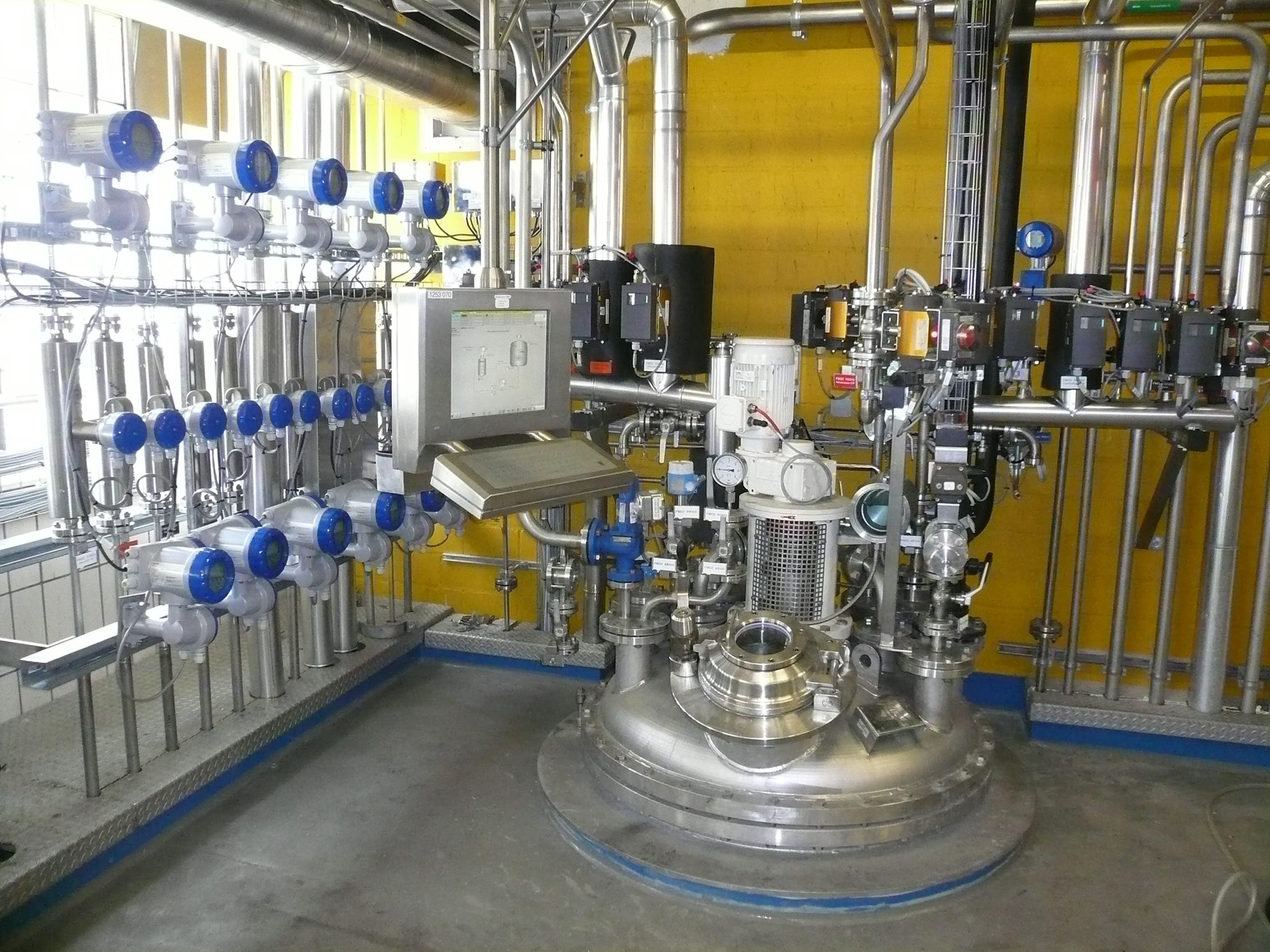 Chemical dosing into liquid mixer