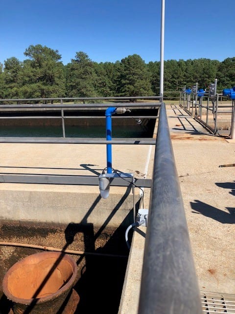 FMCW radar installed next to the overflow pipe